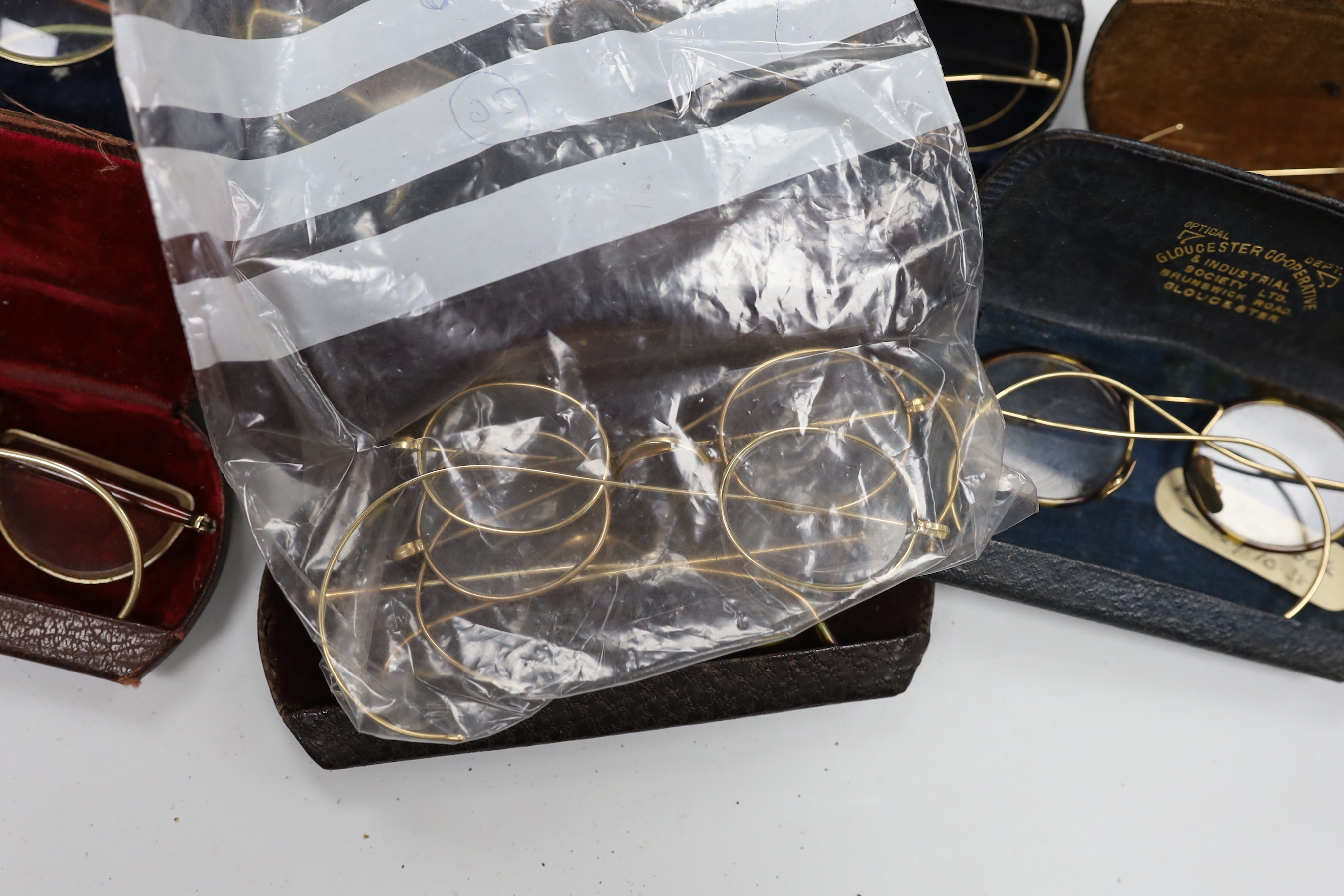 A quantity of spectacles and cases